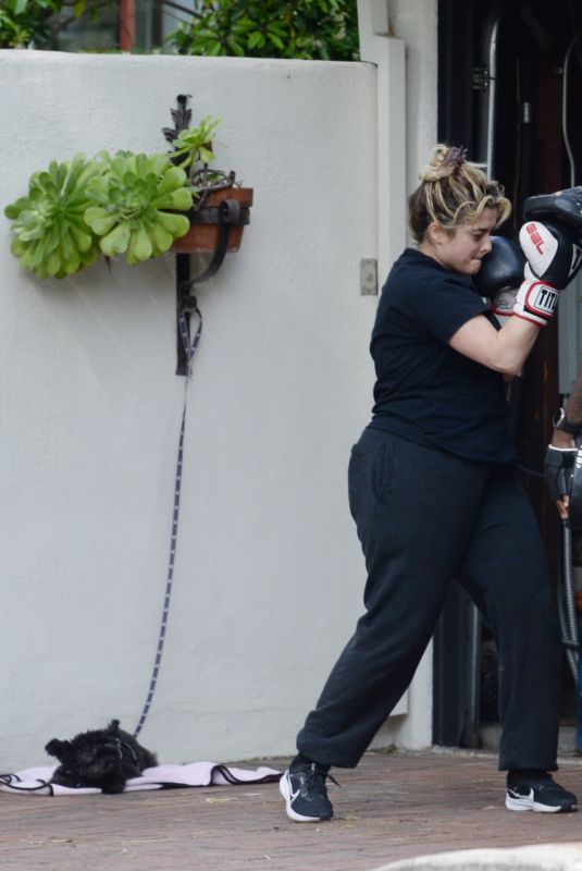 BEBE REXHA Shows off Her Boxing Skills with a Trainer in Los Angeles 03/16/2024