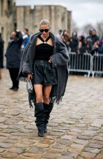 CAROLINE DAUR Arrives at Loewe Fashion Show at Paris Fashion Week 03/01/2024