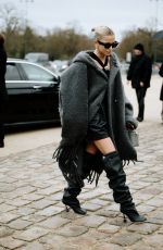 CAROLINE DAUR Arrives at Loewe Fashion Show at Paris Fashion Week 03/01/2024