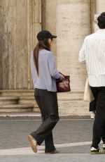 DAKOTA JOHNSON and Chris Martin Out in Rome 03/21/2024