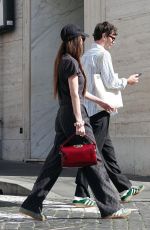 DAKOTA JOHNSON and Chris Martin Out in Rome 03/21/2024