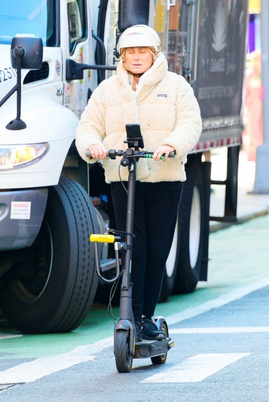DEBORRA-LEE FUENTES Riding an Electric Scooter Out in New York 03/25/2024
