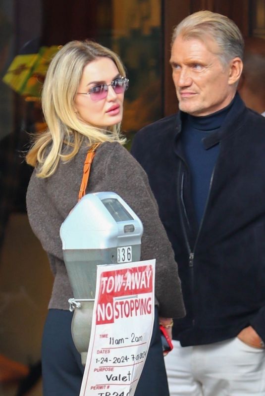EMMA KROKDAL and Dolph Lundgren Out for Early Dinner at Cipriani in Beverly Hills 03/03/2024