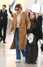 GISELE BUNDCHEN Catches a Flight Out of New York 03/22/2024