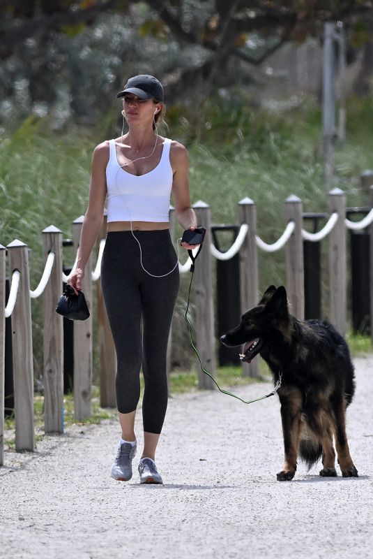GISELE BUNDCHEN Out with Her German Shepherd at Beach Path in Surfside 03/03/2024