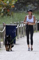 GISELE BUNDCHEN Out with Her German Shepherd at Beach Path in Surfside 03/03/2024