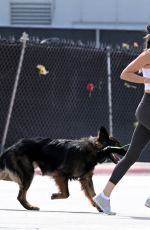 GISELE BUNDCHEN Out with Her German Shepherd at Beach Path in Surfside 03/03/2024