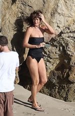 HELENA CHRISTENSEN in Swimsuit at a Phostohoot on the Beach in Malibu 03/12/2024