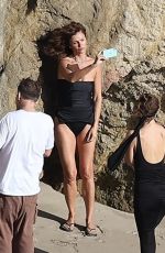 HELENA CHRISTENSEN in Swimsuit at a Phostohoot on the Beach in Malibu 03/12/2024