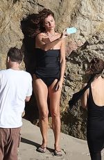 HELENA CHRISTENSEN in Swimsuit at a Phostohoot on the Beach in Malibu 03/12/2024