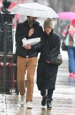 JULIANNE MOORE and Bart Freundlich Out on Rainy Day in New York 03/06/2024