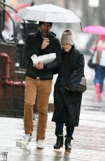 JULIANNE MOORE and Bart Freundlich Out on Rainy Day in New York 03/06/2024