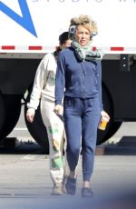 KATE HUDSON Steps Out on Set with Curlers in Her Hair 03/18/2024