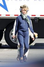 KATE HUDSON Steps Out on Set with Curlers in Her Hair 03/18/2024