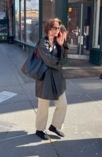 KATIE HOLMES Takes a Call Out in New York 03/01/2024