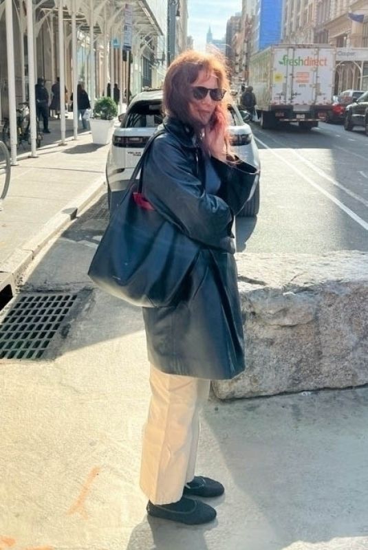 KATIE HOLMES Takes a Call Out in New York 03/01/2024