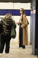 KATIE HOLMES Waiting for a Uptown Train in New York 03/24/2024
