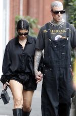 KOURTNEY KARDASHIAN and Travis Barker at Cafe Smith and Deli in Melbourne 02/28/2024