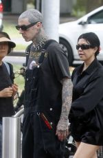 KOURTNEY KARDASHIAN and Travis Barker at Cafe Smith and Deli in Melbourne 02/28/2024