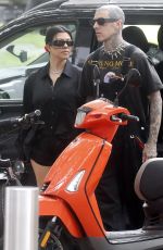 KOURTNEY KARDASHIAN and Travis Barker at Cafe Smith and Deli in Melbourne 02/28/2024