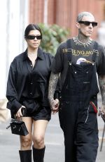 KOURTNEY KARDASHIAN and Travis Barker at Cafe Smith and Deli in Melbourne 02/28/2024