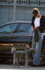 LAURA HARRIER Out with Her Dog in West Hollywood 03/20/2024