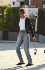 LAURA HARRIER Out with Her Dog in West Hollywood 03/20/2024