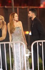 LINDSAY LOHAN and Bader Shammas Leaves Vanity Fair Oscars Party in Beverly Hills 03/10/2024
