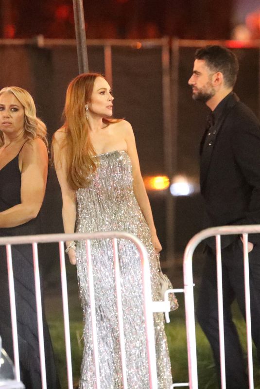 LINDSAY LOHAN and Bader Shammas Leaves Vanity Fair Oscars Party in Beverly Hills 03/10/2024