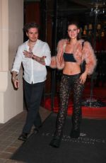 NICOLA PELTZ and Brooklyn Beckham Out for Dinner at Royal Monceau in Paris 03/03/2024
