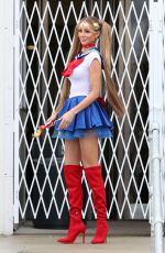 OLIVIA ATTWOOD on the Set of Getting Filthy Rich at Comic-Con at Olympia in London 03/04/2024