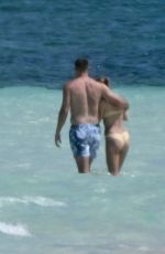 TAYLOR SWIFT in Bikini and Travis Kelce at a Beach in Bahamas 03/21/2024
