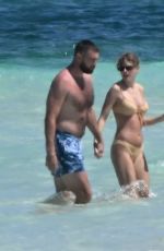 TAYLOR SWIFT in Bikini and Travis Kelce at a Beach in Bahamas 03/21/2024