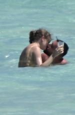 TAYLOR SWIFT in Bikini and Travis Kelce at a Beach in Bahamas 03/21/2024