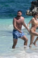 TAYLOR SWIFT in Bikini and Travis Kelce at a Beach in Bahamas 03/21/2024