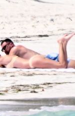 TAYLOR SWIFT in Bikini and Travis Kelce at a Beach in Bahamas 03/21/2024