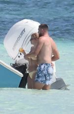 TAYLOR SWIFT in Bikini and Travis Kelce at a Beach in Bahamas 03/21/2024