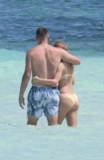 TAYLOR SWIFT in Bikini and Travis Kelce at a Beach in Bahamas 03/21/2024