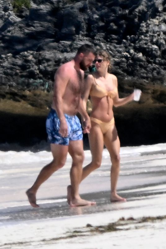 TAYLOR SWIFT in Bikini and Travis Kelce at a Beach in Bahamas 03/21/2024