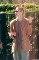WHITNEY PORT Leaves a Business Meeting Enjoying a Treat on the go 03/08/2024