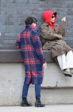 ZOE KRAVITZ Chatting With a Friend on a Loading Dock in New York 03/17/2024