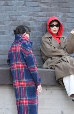 ZOE KRAVITZ Chatting With a Friend on a Loading Dock in New York 03/17/2024