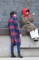 ZOE KRAVITZ Chatting With a Friend on a Loading Dock in New York 03/17/2024