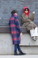 ZOE KRAVITZ Chatting With a Friend on a Loading Dock in New York 03/17/2024
