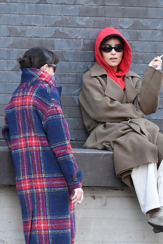 ZOE KRAVITZ Chatting With a Friend on a Loading Dock in New York 03/17/2024