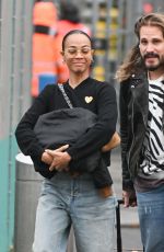 ZOE SALDANA and Marco Perego Arrives at JFK Airport in New York 03/27/2024