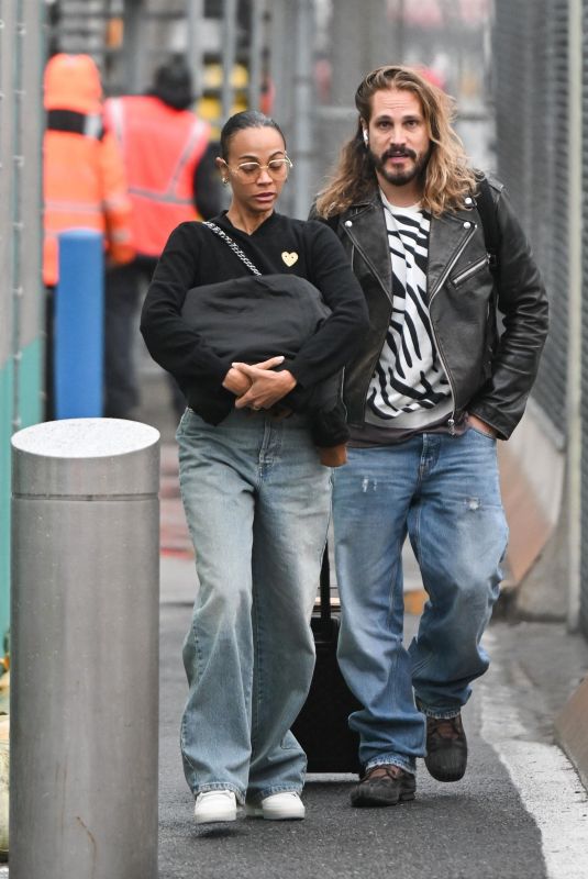 ZOE SALDANA and Marco Perego Arrives at JFK Airport in New York 03/27/2024