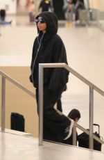 CHLOE BAILEY Arrives at LAX Airport in Los Angeles 04/02/2024
