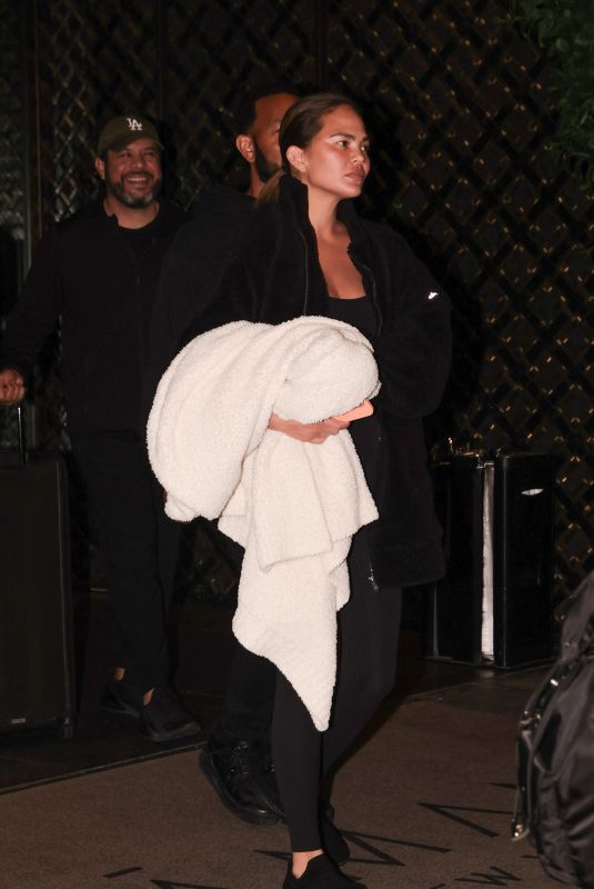 CHRISSY TEIGEN Leaves Her Hotel in New York 04/11/2024