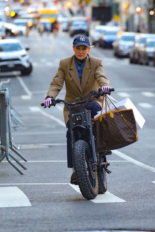 DIANE KRUGER Out for a Ride on Her Electric Bike in New York 04/26/2024